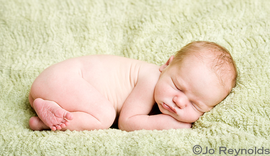 Curly newborn baby