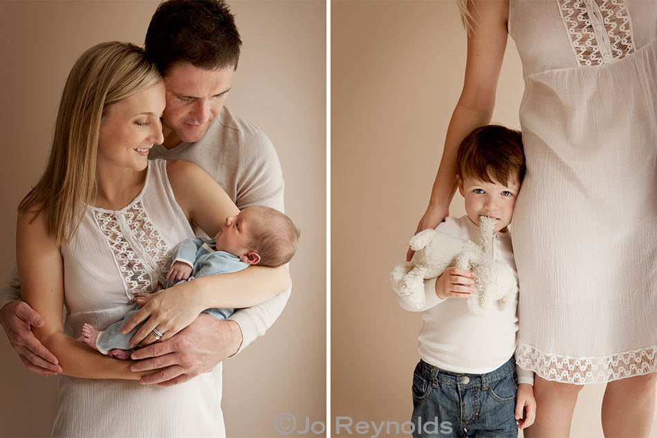 Newborn with parents, sibling with toy